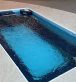 Endless swimming exercise pool for compact home fitness and continuous swimming workout